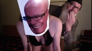 Illustration for article titled Randy Quaid returns by humping his wife while she wears Rupert Murdoch mask